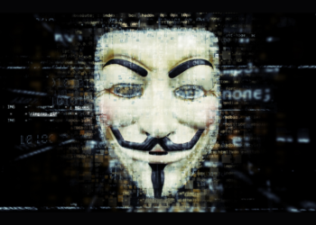 Guy Fawkes mask with traces of programming code swirling around it.